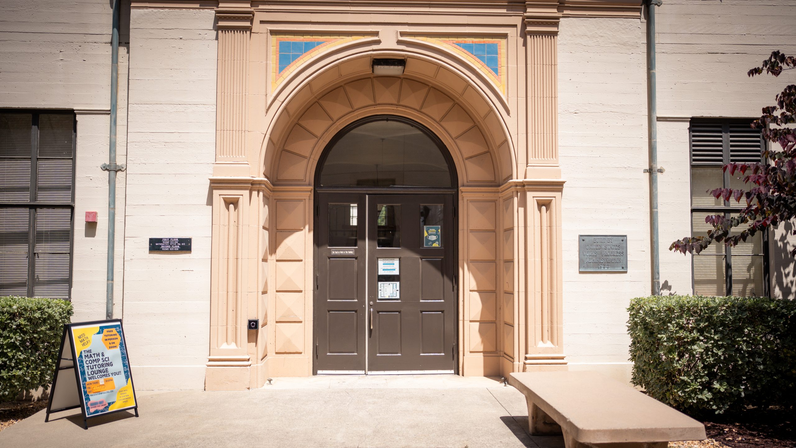 Entrance to Building 600, featuring a sign outside for the Math & Computer Science Tutoring Lounge.